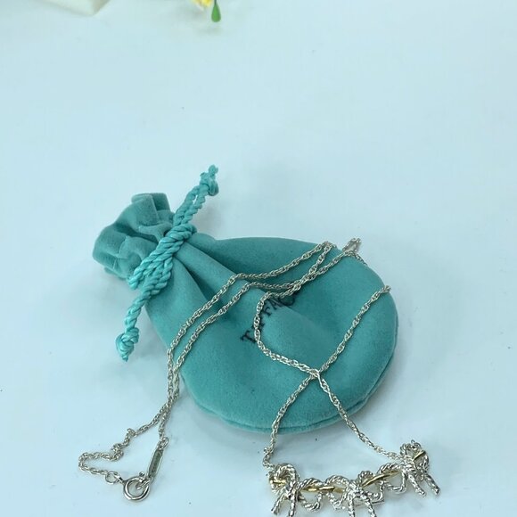 Tiffany & Co.Sterling 18K Gold Triple Ribbon Bow Pendant...
